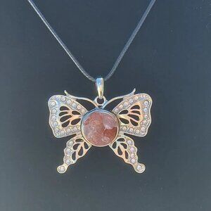 Lovely Strawberry Quartz butterfly with 24 inch cord necklace